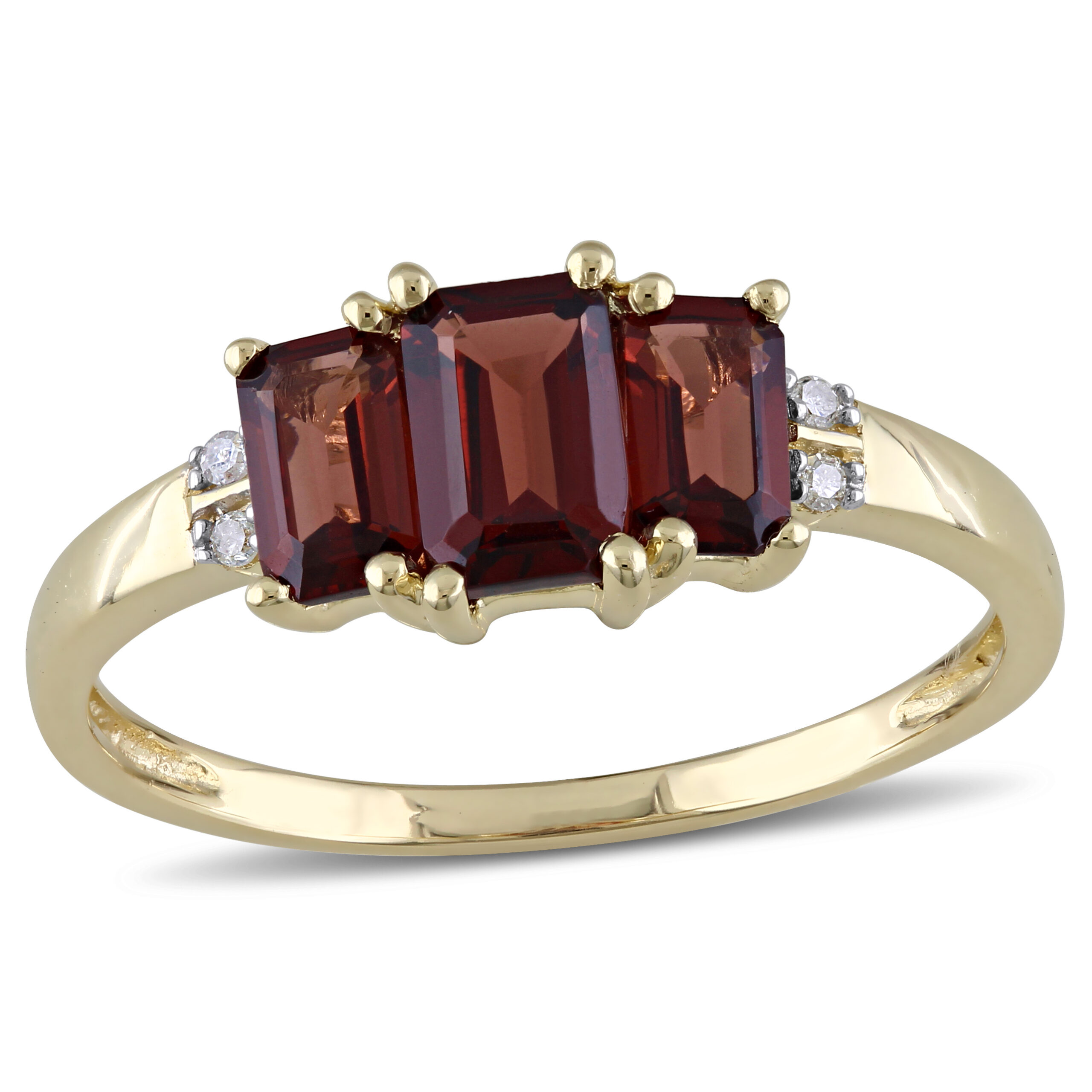 garnet three stone ring in yellow gold