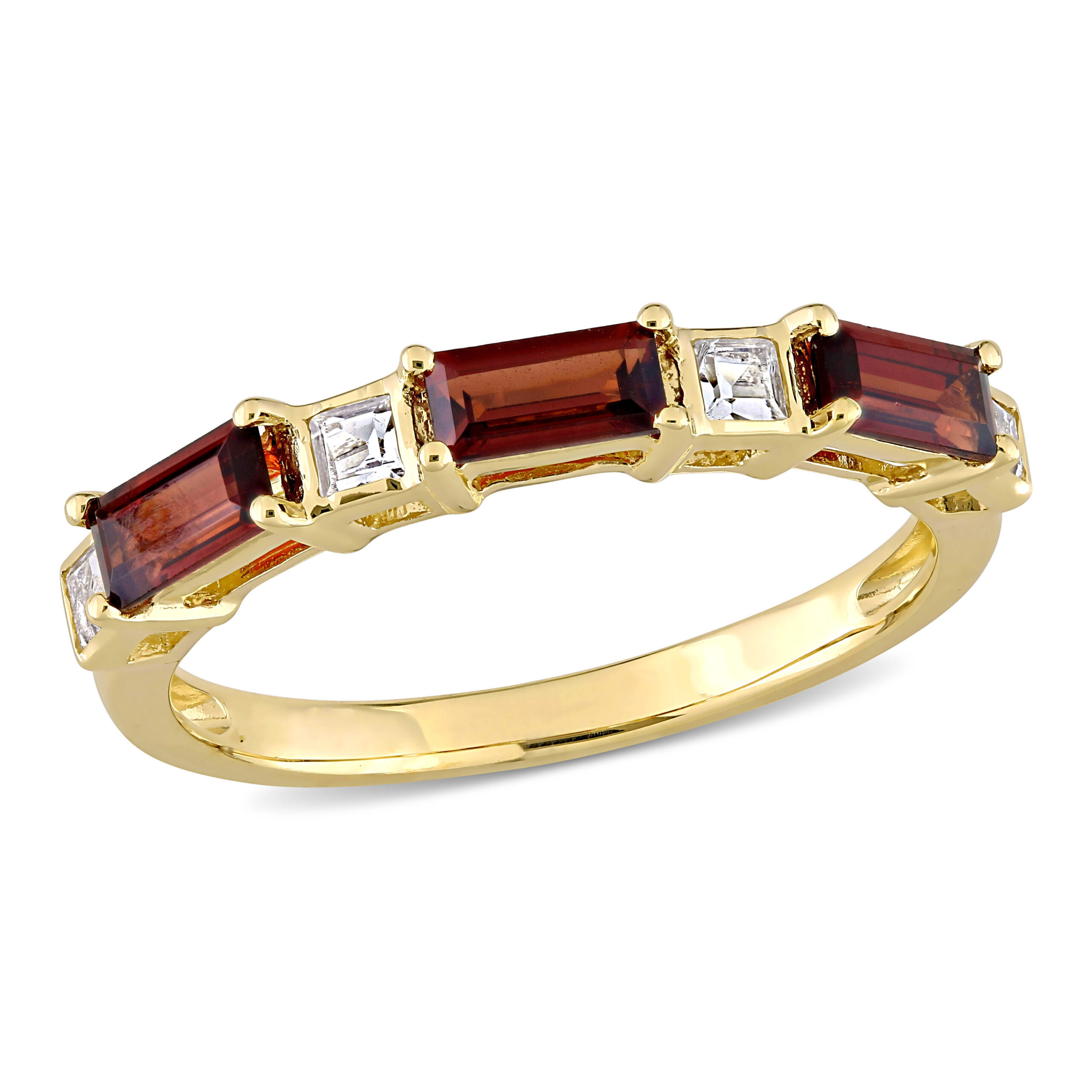 three stone slim garnet ring set in yellow gold with diamond accents